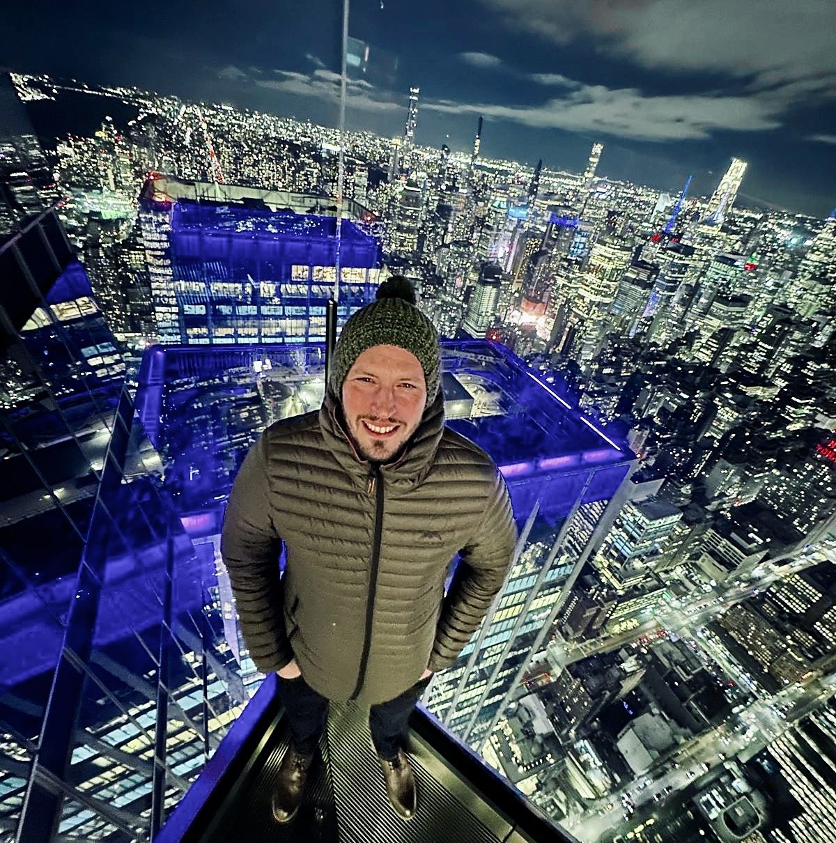Ian Sharpe above the Manhattan skyline at night